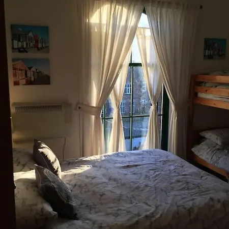 Converted Chapel Floor To Ceiling Arch Window Apartament